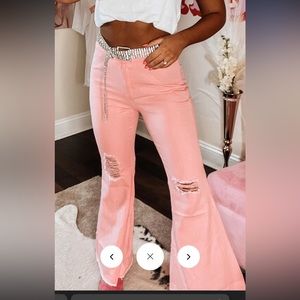 Bubble gum pink. Bell bottom jeans. Have two pair 1 small and 1 medium.